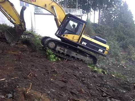 how to drive a mini excavator up a hill|mini ex drive up hill.